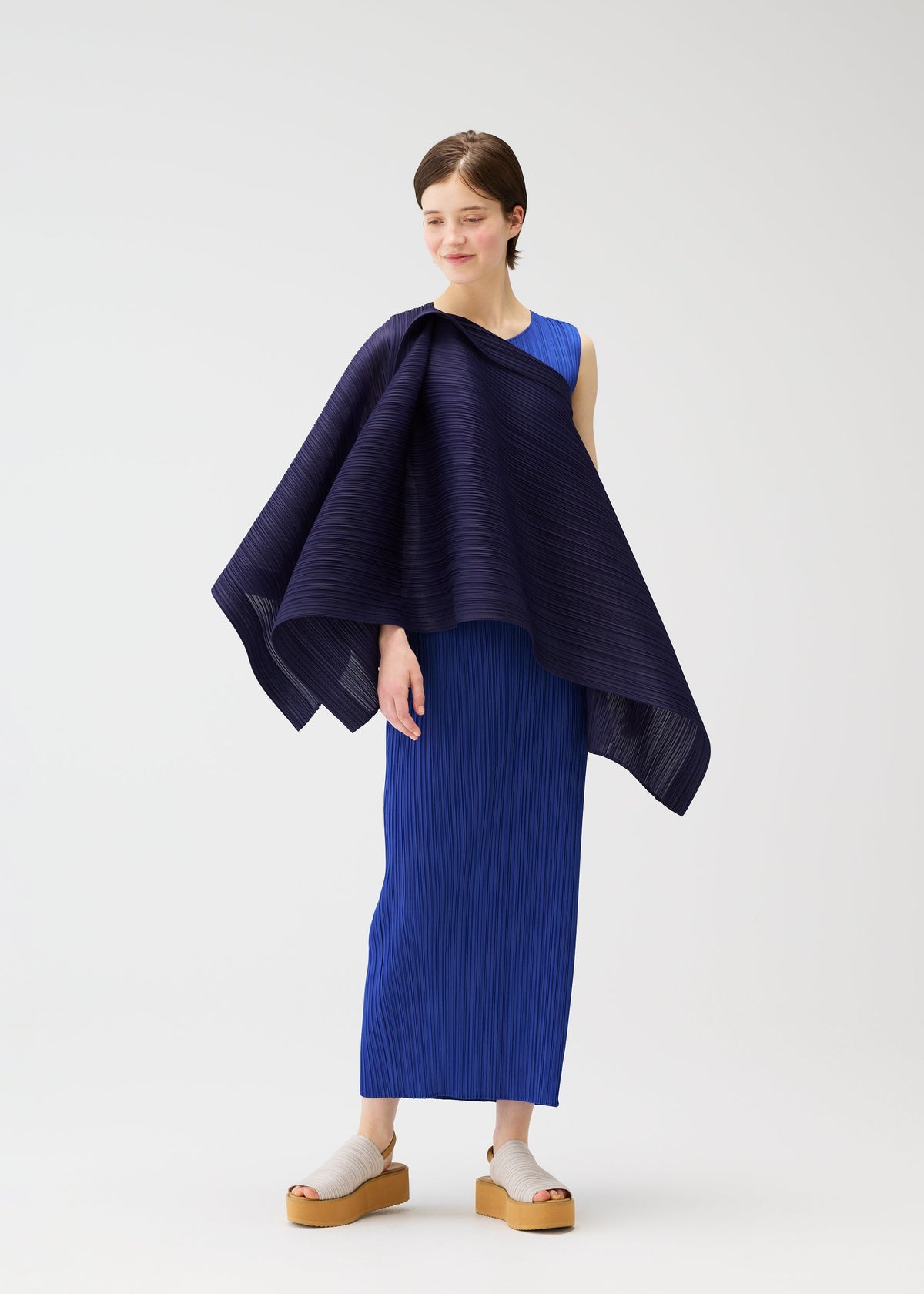 A model wears the PLEATS PLEASE ISSEY MIYAKE LUCID PLEATS vest.
