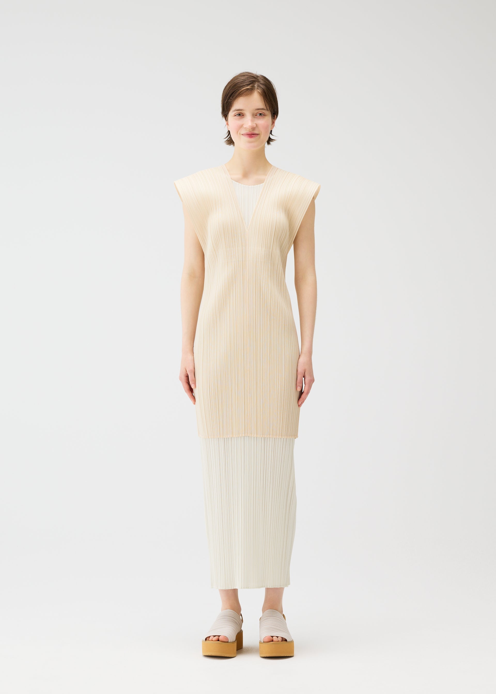 A model wears the PLEATS PLEASE ISSEY MIYAKE LUCID PLEATS vest.