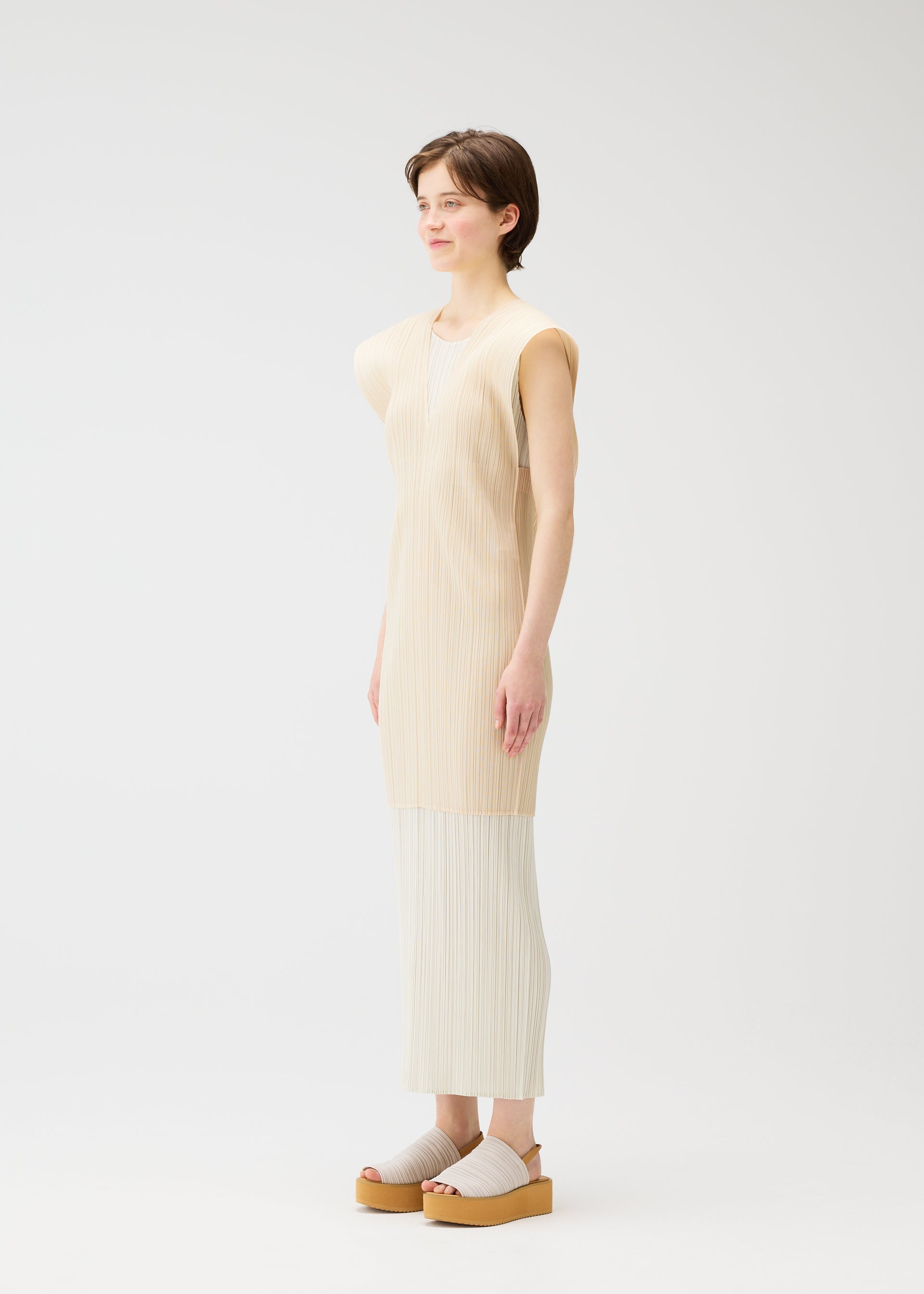 A model wears the PLEATS PLEASE ISSEY MIYAKE LUCID PLEATS vest.