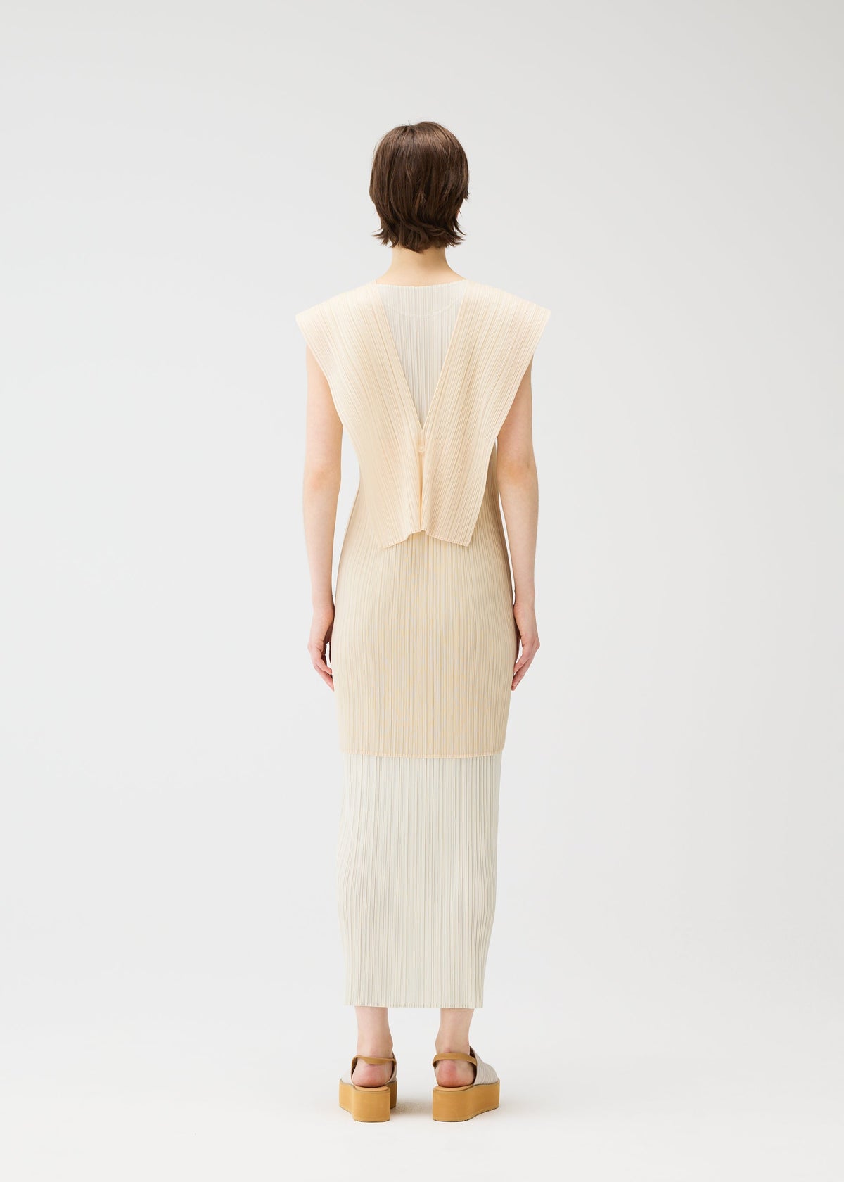 A model wears the PLEATS PLEASE ISSEY MIYAKE LUCID PLEATS vest.