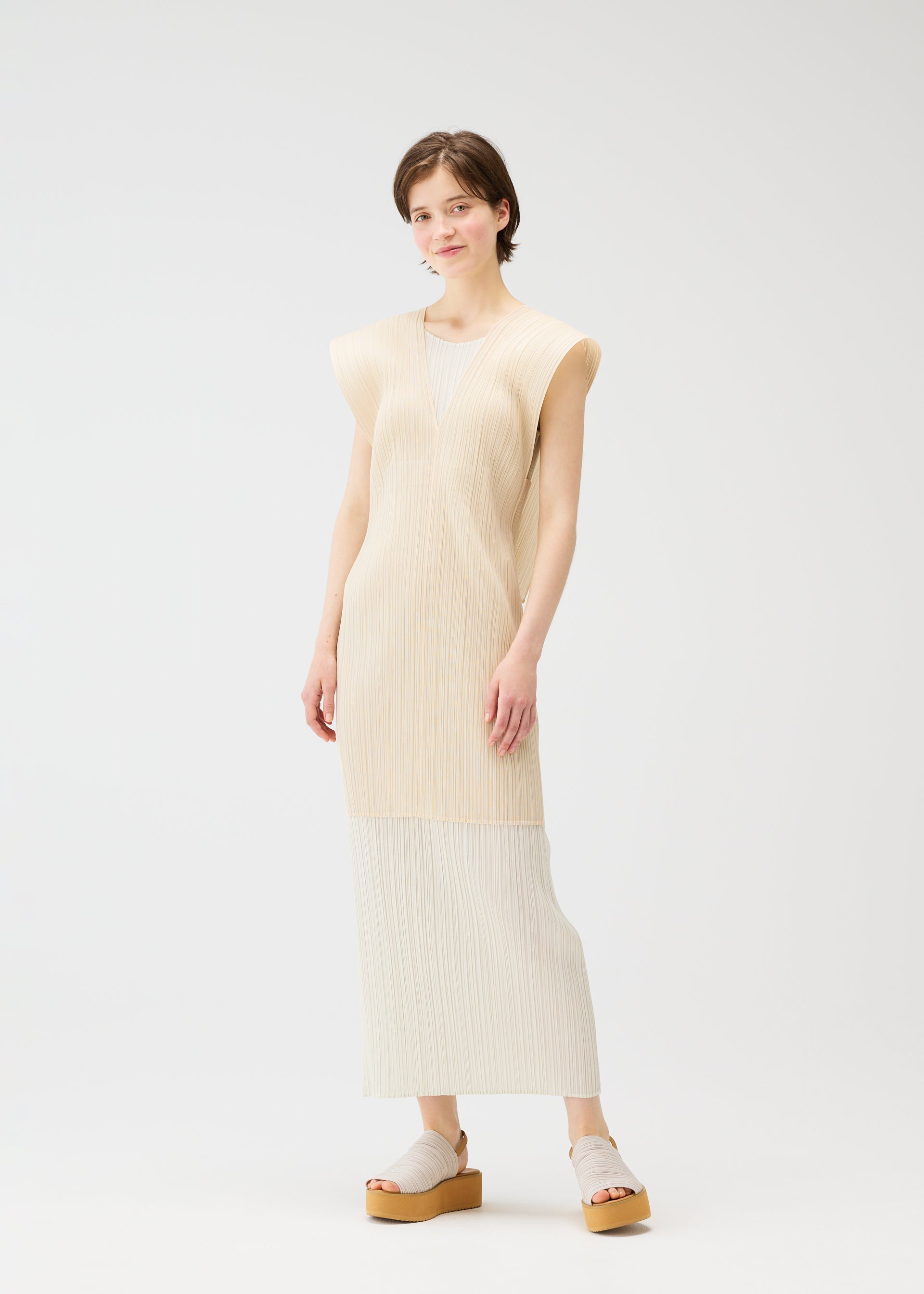 A model wears the PLEATS PLEASE ISSEY MIYAKE LUCID PLEATS vest.