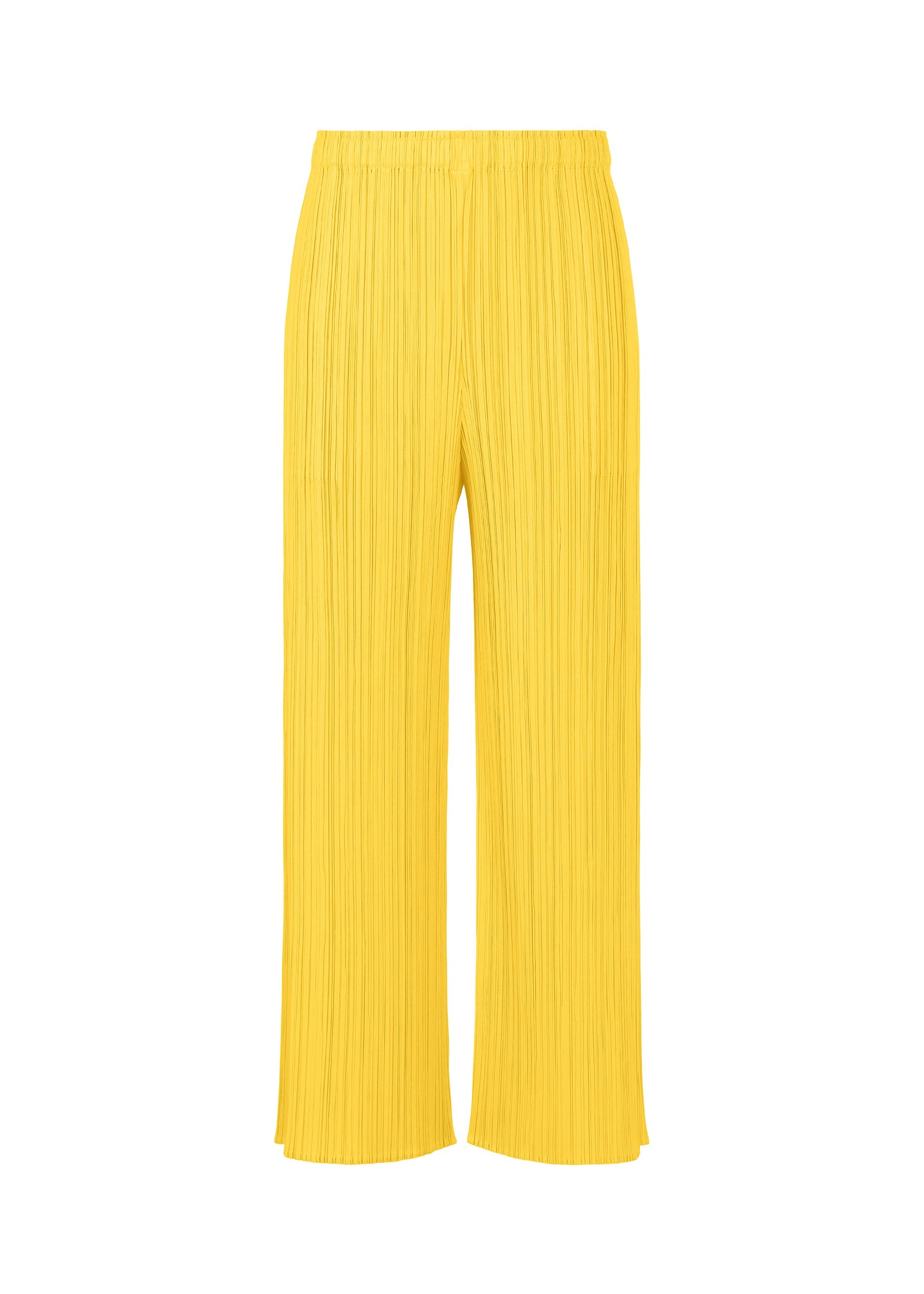 A product shot of the PLEATS PLEASE ISSEY MIYAKE MONTHLY COLORS APRIL trousers in yellow (52).