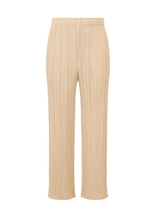 A product shot of the PLEATS PLEASE ISSEY MIYAKE MONTHLY COLORS MAY trousers in sand beige (43).