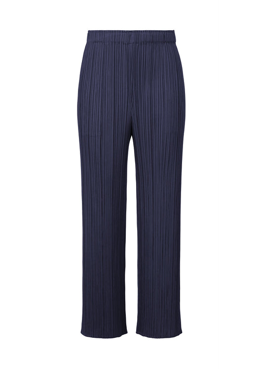 A product shot of the PLEATS PLEASE ISSEY MIYAKE MONTHLY COLORS MAY trousers in navy (75).
