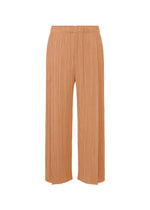 A product shot of the PLEATS PLEASE ISSEY MIYAKE MONTHLY COLORS : JUNE trousers in pink beige.
