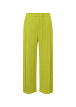 A product shot of the PLEATS PLEASE ISSEY MIYAKE MONTHLY COLORS : JUNE trousers in yellow green.
