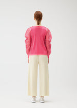 A model wears the PLEATS PLEASE ISSEY MIYAKE OPAQUE BOTTOMS opaque-bottoms-trousers-charcoal.