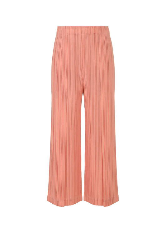A product shot of the PLEATS PLEASE ISSEY MIYAKE RAMIE PLEATS trousers in coral pink (29).