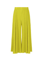 A product shot of the PLEATS PLEASE ISSEY MIYAKE MELLOW PLEATS trousers in mustard (58).