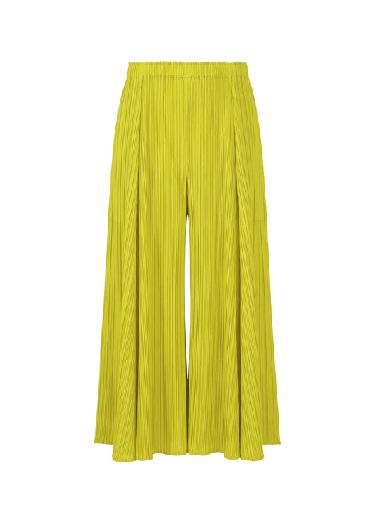 A product shot of the PLEATS PLEASE ISSEY MIYAKE MELLOW PLEATS trousers in mustard (58).