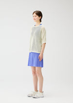 A model wears the PLEATS PLEASE ISSEY MIYAKE LOOP BOTTOMS shorts.