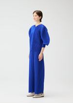 A model wears the PLEATS PLEASE ISSEY MIYAKE COAST trousers.