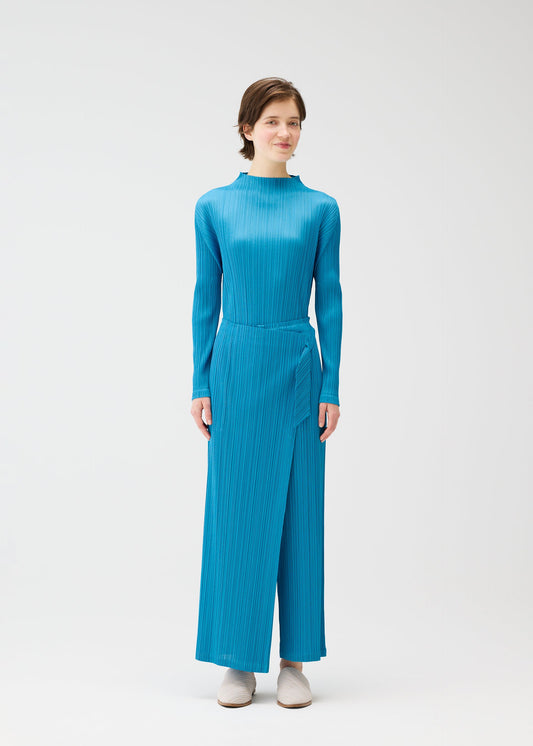 A model wears the PLEATS PLEASE ISSEY MIYAKE FACADE trousers.