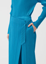 A model wears the PLEATS PLEASE ISSEY MIYAKE FACADE trousers.