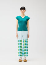 A model wears the PLEATS PLEASE ISSEY MIYAKE BUMPY BASKET bumpy-basket-trousers-pink.