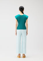 A model wears the PLEATS PLEASE ISSEY MIYAKE BUMPY BASKET bumpy-basket-trousers-green.