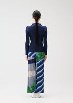 A model wears the PLEATS PLEASE ISSEY MIYAKE CITY COLLAGE clothing.