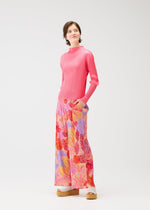 A model wears the PLEATS PLEASE ISSEY MIYAKE FOGGY FOREST trousers.