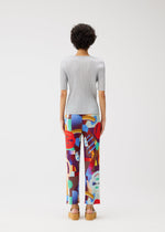 A model wears the PLEATS PLEASE ISSEY MIYAKE PLAYGROUND trousers.