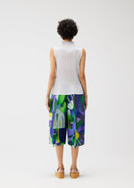 A model wears the PLEATS PLEASE ISSEY MIYAKE PLAYGROUND trousers.