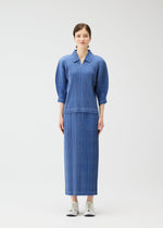 A model wears the PLEATS PLEASE ISSEY MIYAKE COTTON DENIM skirt.