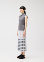 A model wears the PLEATS PLEASE ISSEY MIYAKE BUMPY BASKET bumpy-basket-skirt-pink.