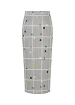 A detail shot of the PLEATS PLEASE ISSEY MIYAKE CROSSING DOTS skirt.