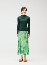 A model wears the PLEATS PLEASE ISSEY MIYAKE FOGGY FOREST skirt.