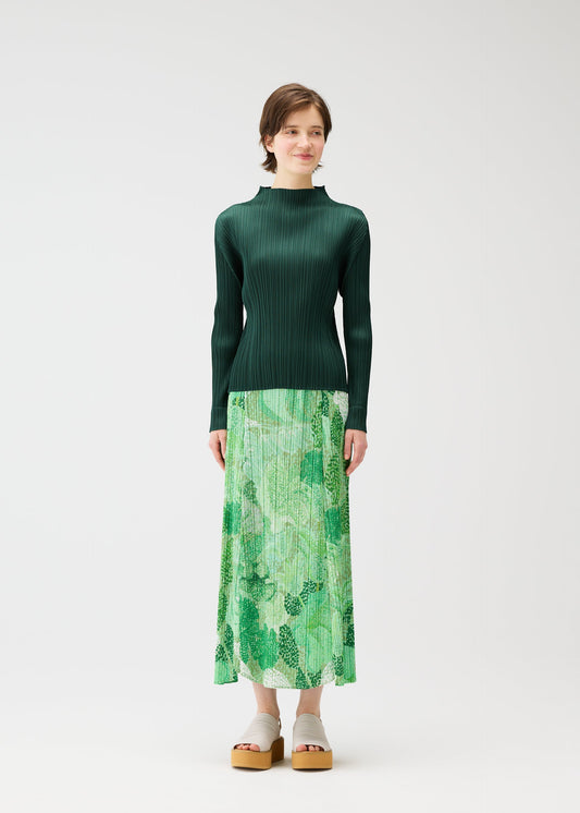 A model wears the PLEATS PLEASE ISSEY MIYAKE FOGGY FOREST skirt.