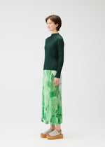 A model wears the PLEATS PLEASE ISSEY MIYAKE FOGGY FOREST skirt.