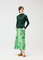 A model wears the PLEATS PLEASE ISSEY MIYAKE FOGGY FOREST skirt.
