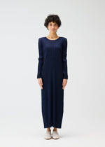 A model wears the PLEATS PLEASE ISSEY MIYAKE MONTHLY COLORS JANUARY clothing.