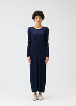A model wears the PLEATS PLEASE ISSEY MIYAKE MONTHLY COLORS JANUARY clothing.