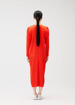 A model wears the PLEATS PLEASE ISSEY MIYAKE MONTHLY COLORS FEBRUARY dress.