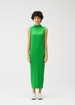 A model wears the PLEATS PLEASE ISSEY MIYAKE MONTHLY COLORS APRIL dress.