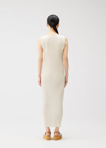 A model wears the PLEATS PLEASE ISSEY MIYAKE MONTHLY COLORS MAY dress.