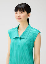 A model wears the PLEATS PLEASE ISSEY MIYAKE MONTHLY COLORS MAY dress.