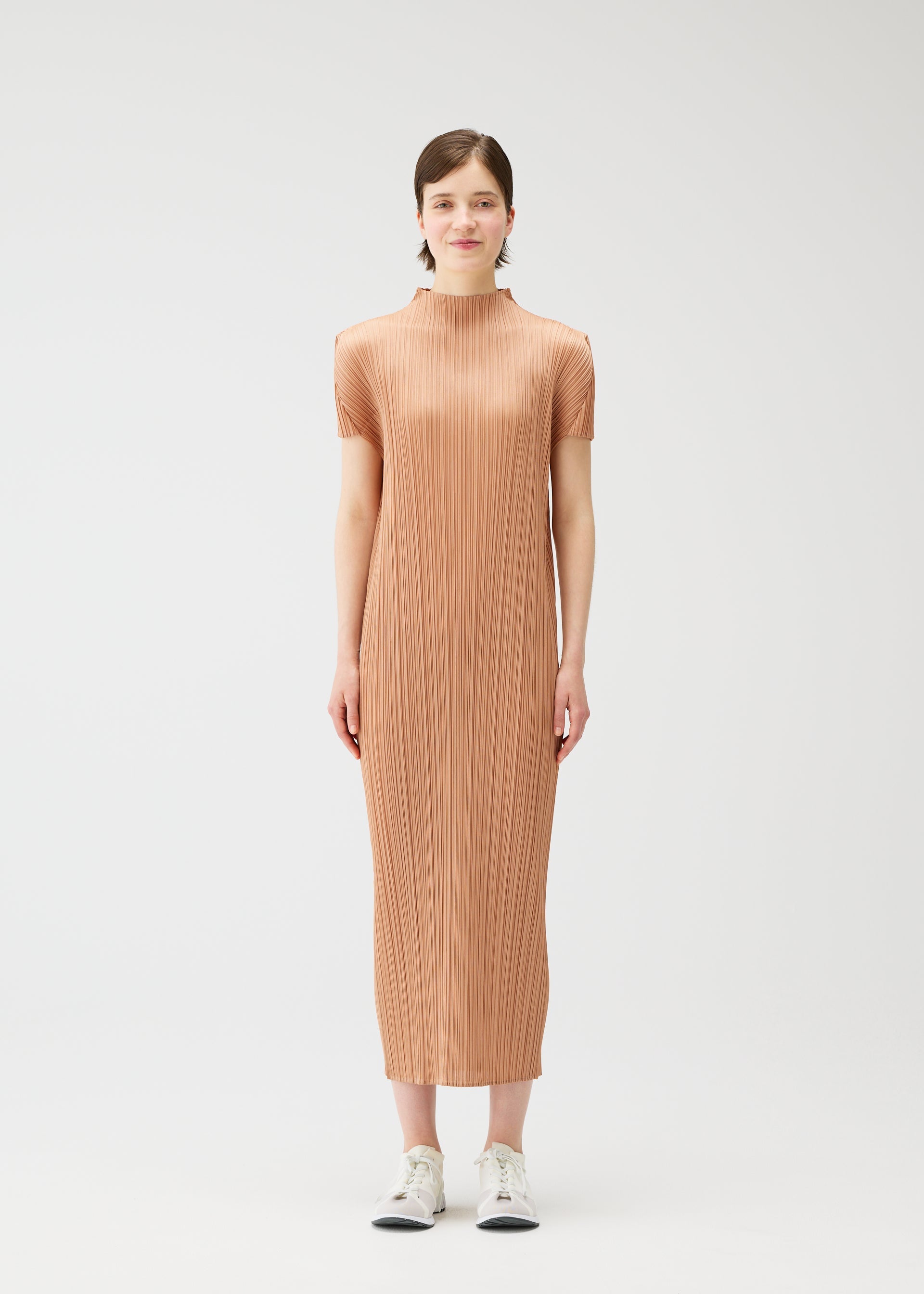 A model wears the PLEATS PLEASE ISSEY MIYAKE MONTHLY COLORS : JUNE monthly-colors-june-dress-yellow-green.