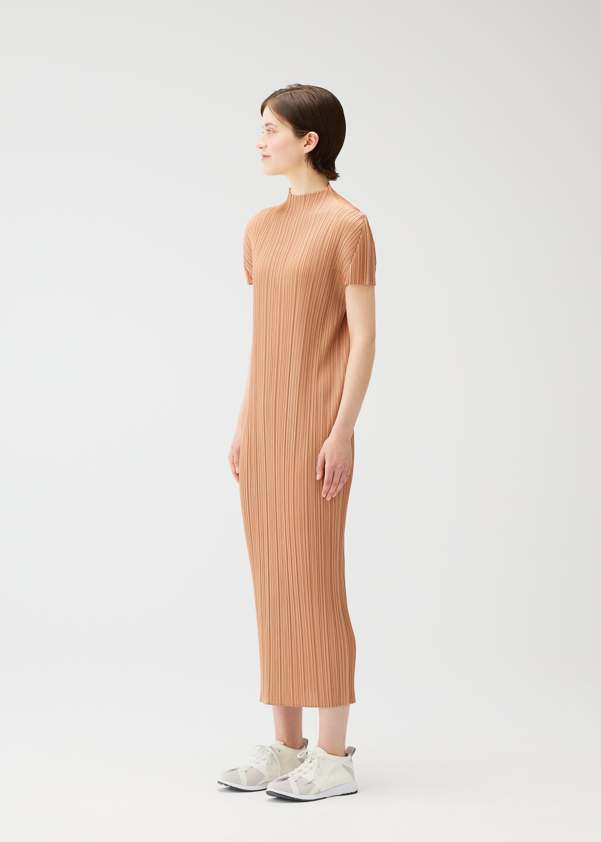 A model wears the PLEATS PLEASE ISSEY MIYAKE MONTHLY COLORS : JUNE monthly-colors-june-dress-charcoal.