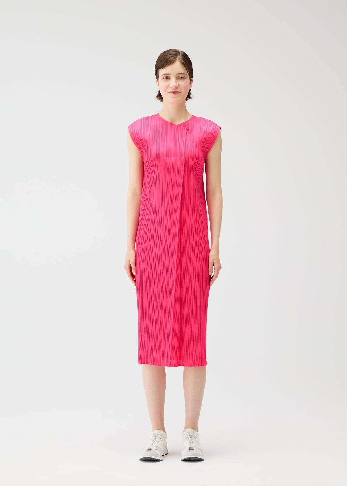 A model wears the PLEATS PLEASE ISSEY MIYAKE MONTHLY COLORS : JUNE monthly-colors-june-dress-bright-pink-1.