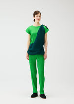 A model wears the PLEATS PLEASE ISSEY MIYAKE SWING dress.