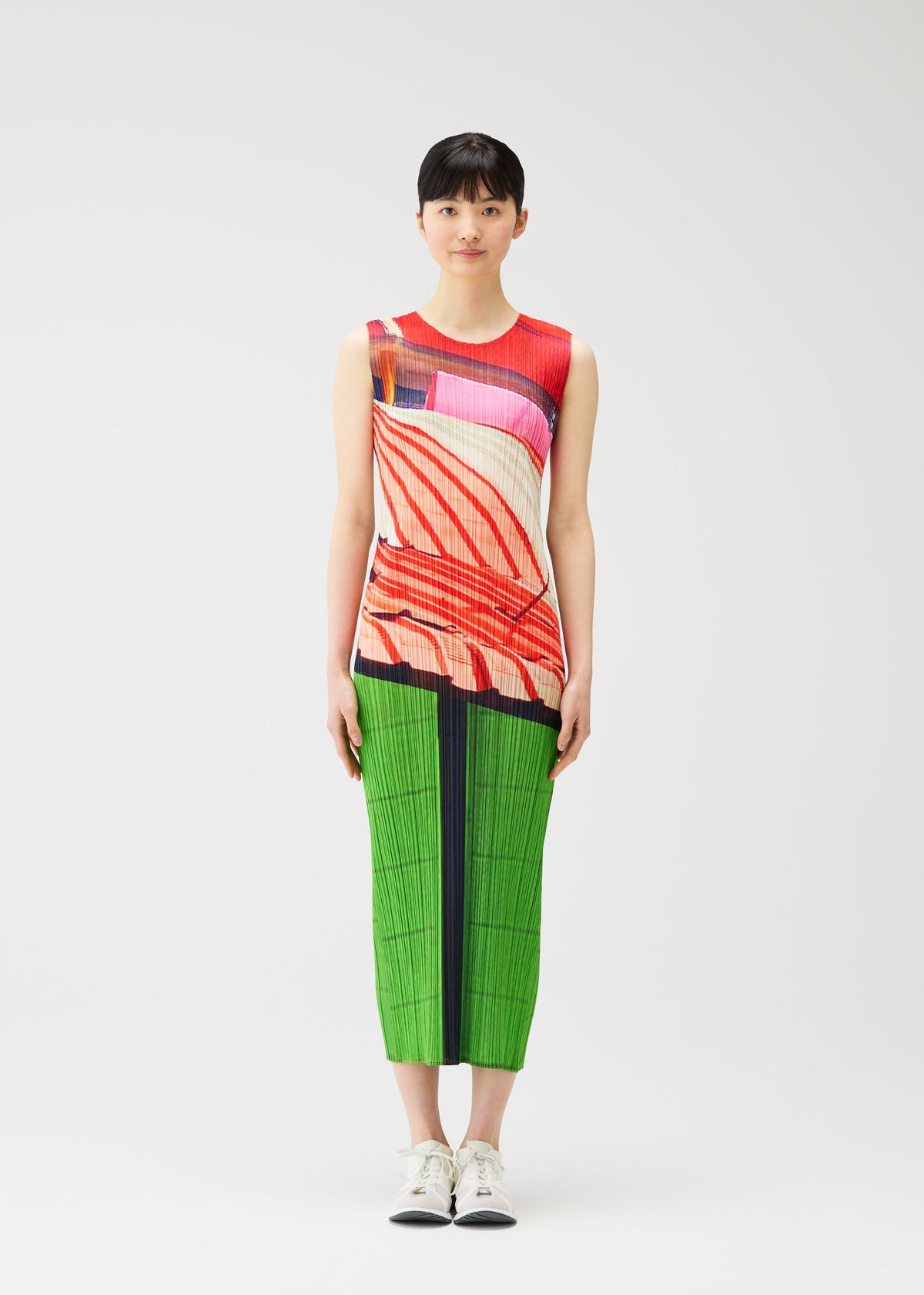 A model wears the PLEATS PLEASE ISSEY MIYAKE CITY COLLAGE clothing.