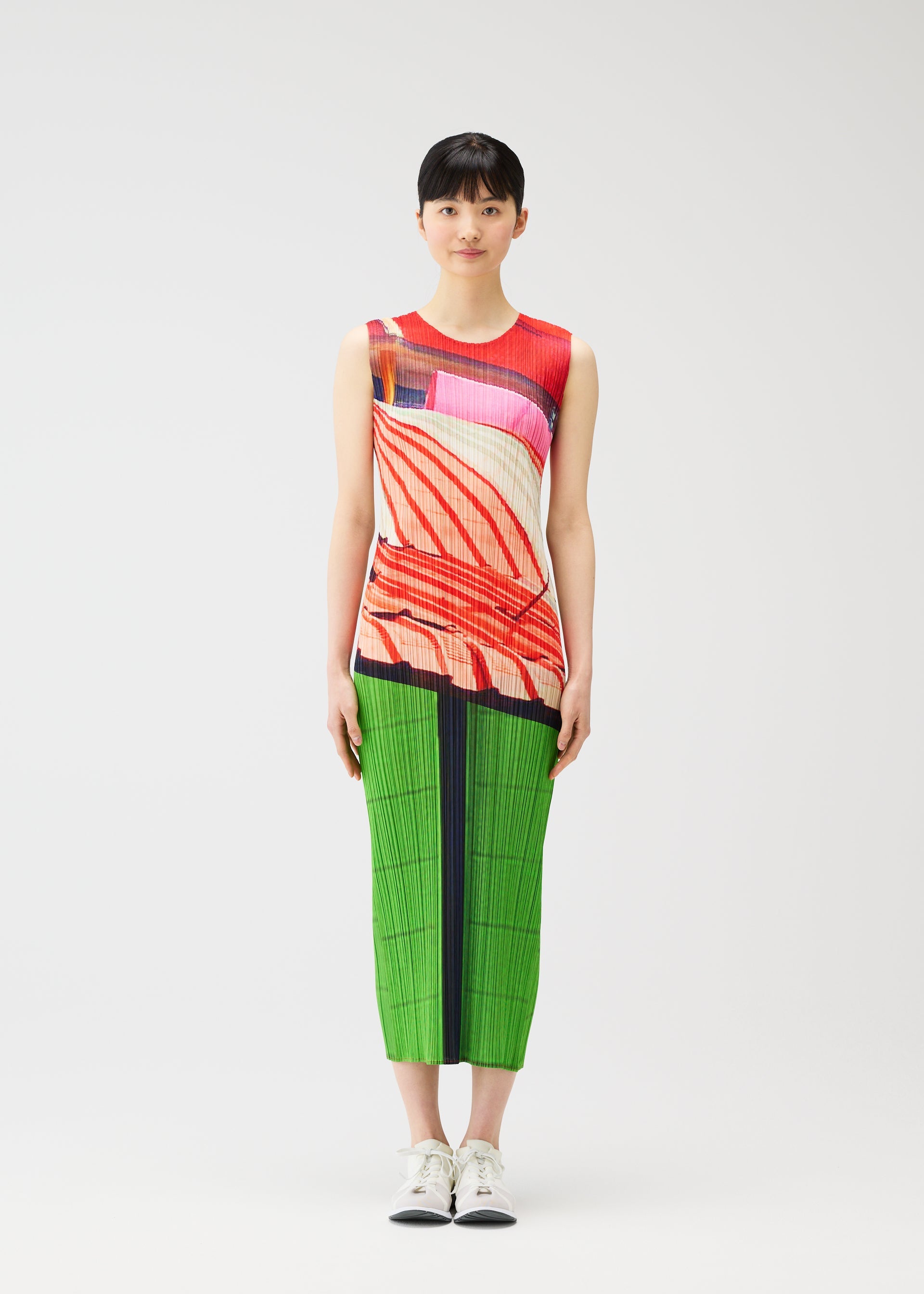 A model wears the PLEATS PLEASE ISSEY MIYAKE CITY COLLAGE clothing.