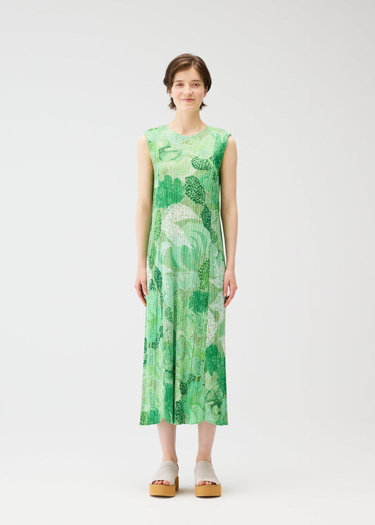 A model wears the PLEATS PLEASE ISSEY MIYAKE FOGGY FOREST dress.