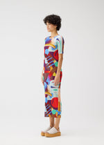 A model wears the PLEATS PLEASE ISSEY MIYAKE PLAYGROUND dress.