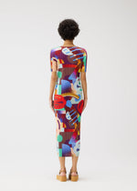 A model wears the PLEATS PLEASE ISSEY MIYAKE PLAYGROUND dress.