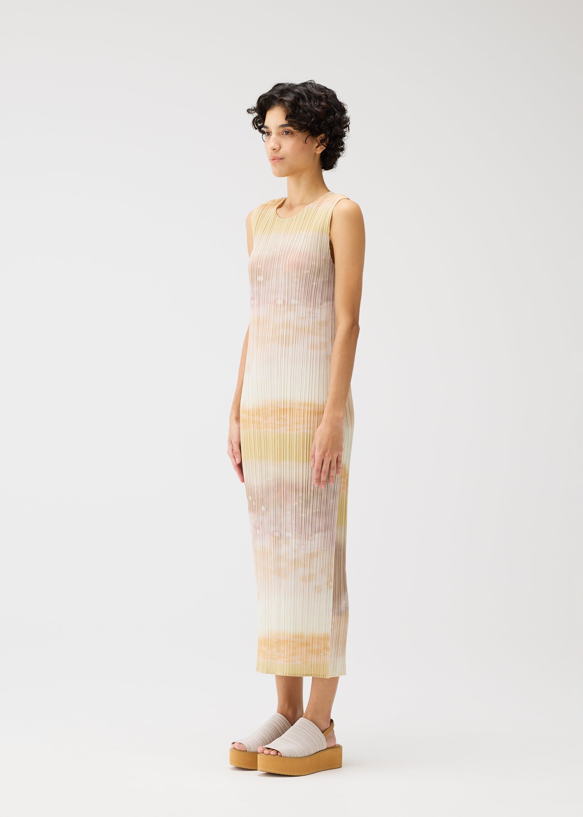 A model wears the PLEATS PLEASE ISSEY MIYAKE SEA BUBBLE dress.