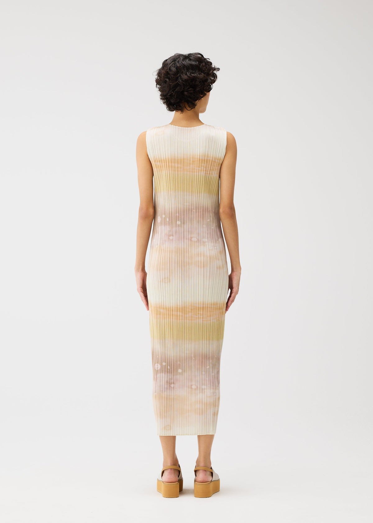 A model wears the PLEATS PLEASE ISSEY MIYAKE SEA BUBBLE dress.