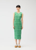 A model wears the PLEATS PLEASE ISSEY MIYAKE BASKET basket-dress-green.
