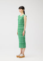 A model wears the PLEATS PLEASE ISSEY MIYAKE BASKET basket-dress-green.